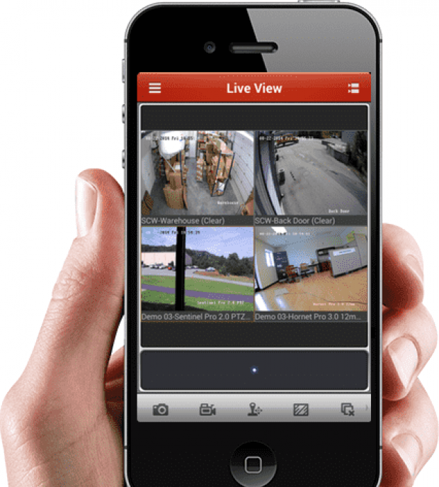 A hand holding a phone with multiple CCTV feed on the screen