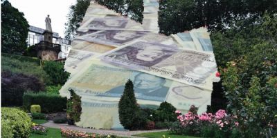 A garden with an image of money replacing the house.
