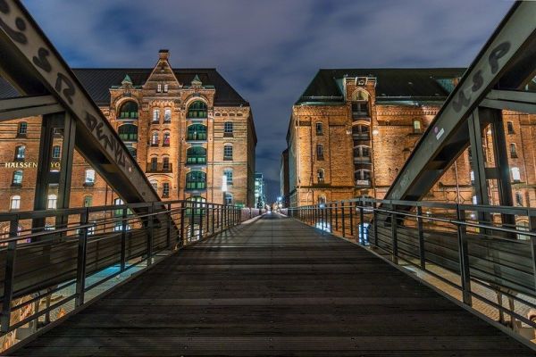 A shot across a bridge with buildings either side.
