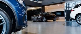 Car dealership showroom with Mercedes and prestige vehicles