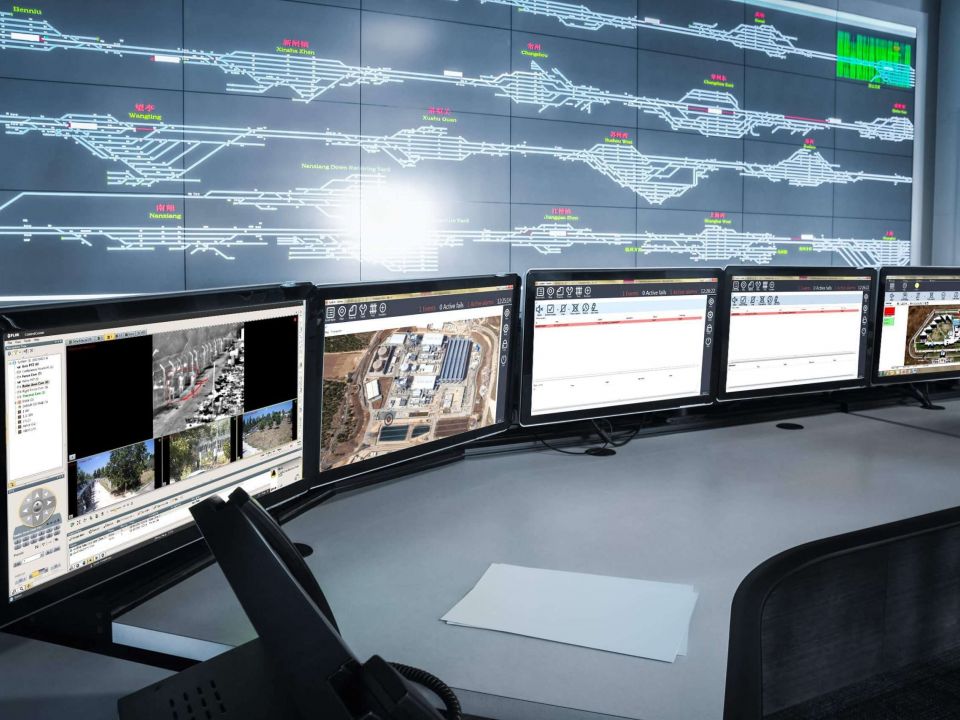 Multiple monitors with real time feeds of site security.