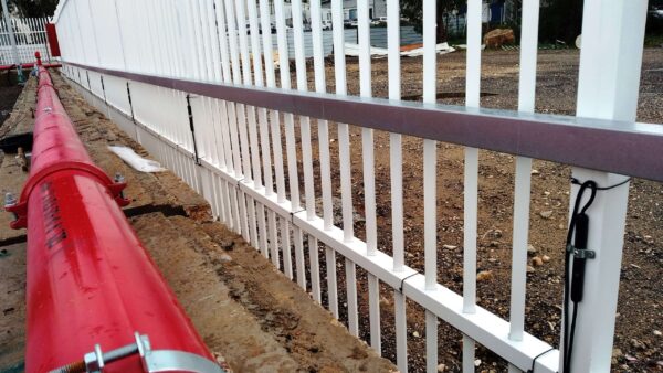 A perimeter fence with an Elec Sens motion sensor detector kit mounted to it.