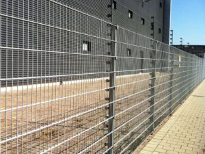 Large commercial storage building with perimeter fencing around it.