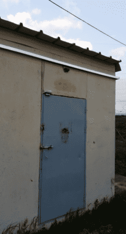 A Spider Sens sensor mounted above a door