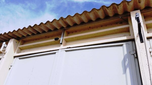 A Spider Sens sensor mounted above a door